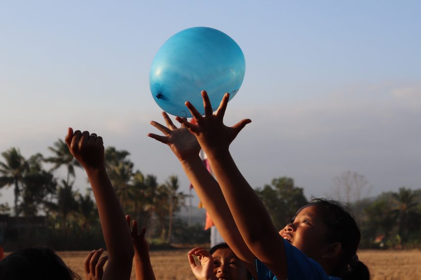 Children playing with balloon